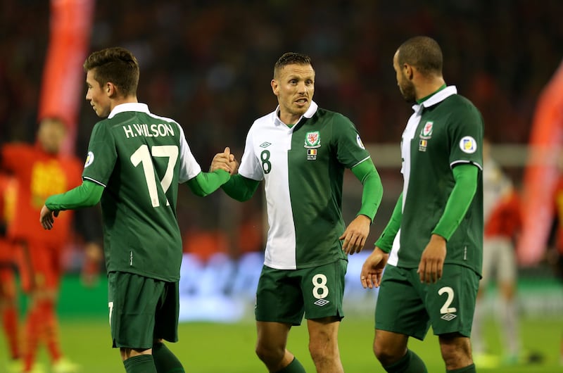 Craig Bellamy (centre) made his final international appearance in the same game which saw Harry Wilson (left) become Wales’ youngest player