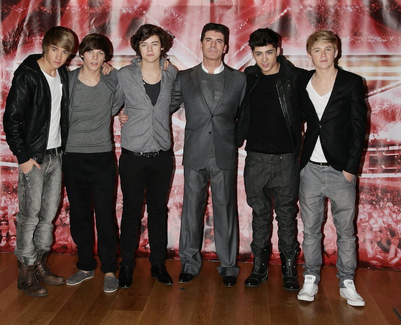 Simon Cowell with One Direction (from left) Liam Payne, Louis Tomlinson, Harry Styles, Zayn Malik and Niall Horan as finalists on The X Factor