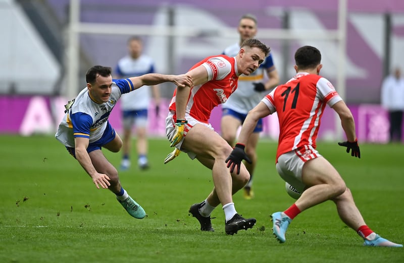 Darragh Canavan of Errigal Ciaran in action against Peadar O Cofaigh Byrne of Cuala.