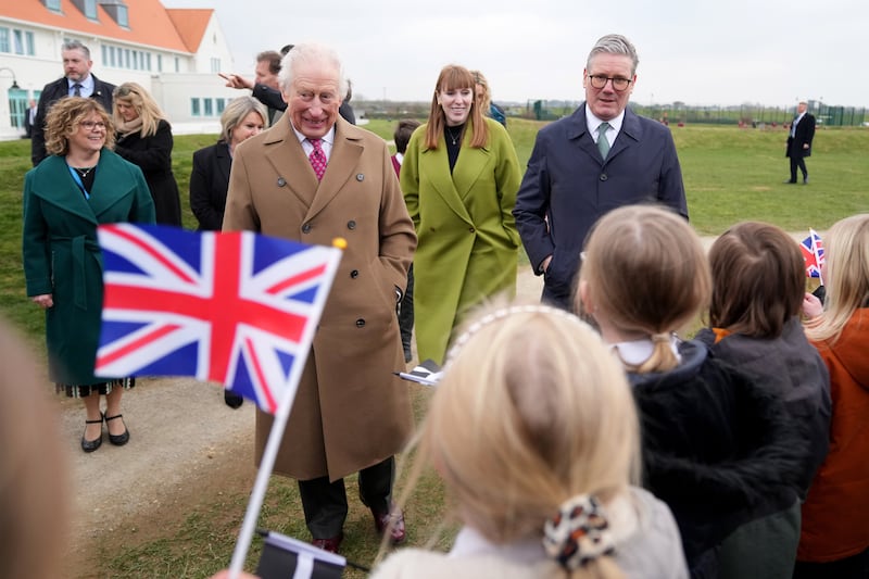 The King accompanied by Prime Minister Sir Keir Starmer and Deputy Prime Minister Angela Rayner during a visit to Nansledan School in Newquay