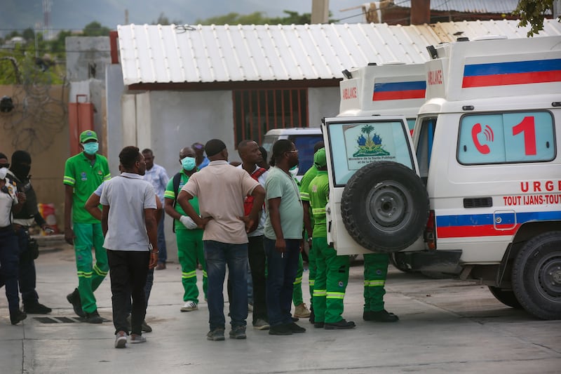 Medics inspect an ambulance of wounded people, shot by armed gangs at the General Hospital in Port-au-Prince, Haiti (Odelyn Joseph/AP)