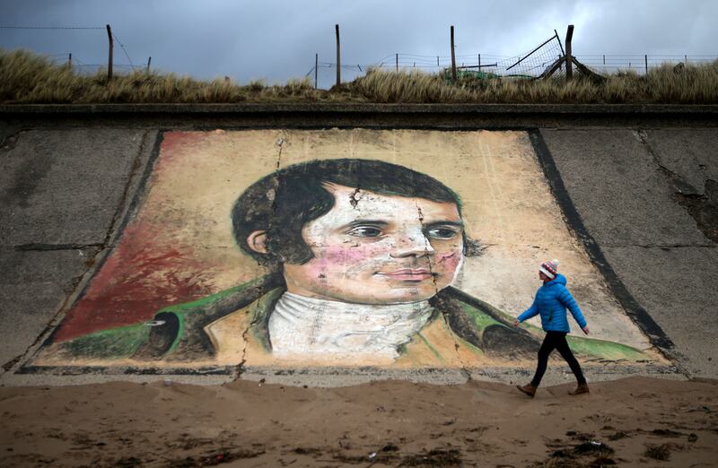 A mural of Robert Burns on the sea wall at Ardeer beach, near his birthplace of Alloway in South Ayrshire