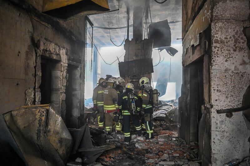 Firefighters inside the damaged building (Mert Gokhan Koc/dia Photo/AP)