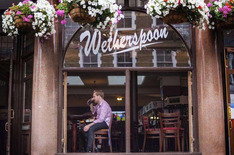 Pub chain JD Wetherspoon has revealed stronger profits for the past year