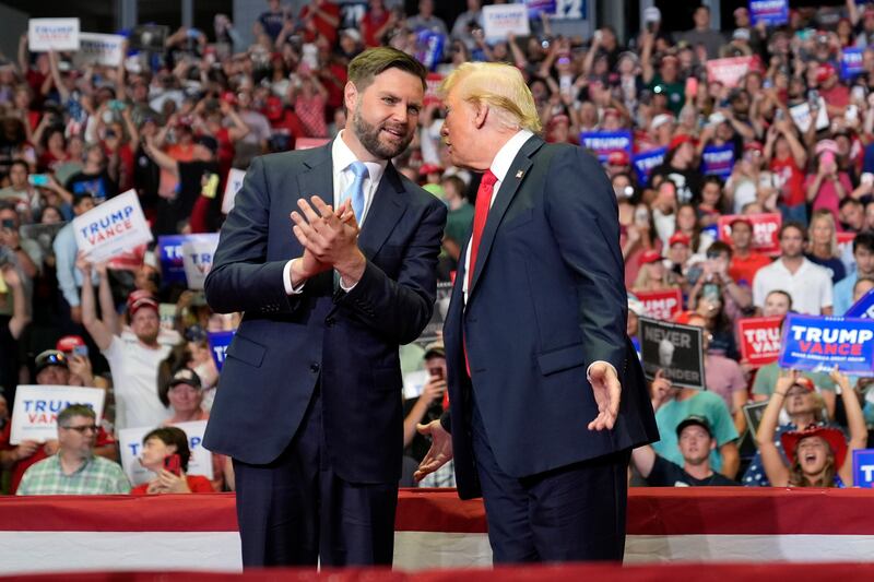 Donald Trump chats to Republican vice presidential candidate JD Vance (Evan Vucci/AP)