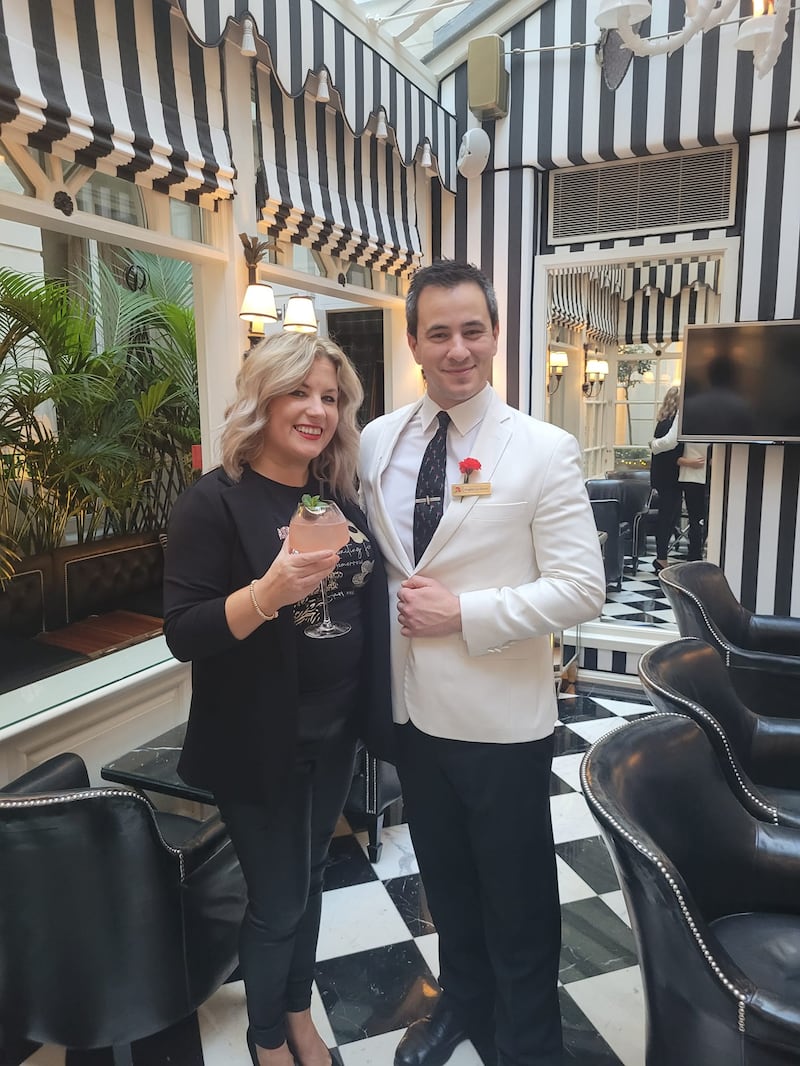 Emma Heatherington pictured in London with Angelo Le Greco, the bar manager  in The Milestone Hotel, Kensington, which inspired one of the setting in her latest novel Maybe Next Christmas