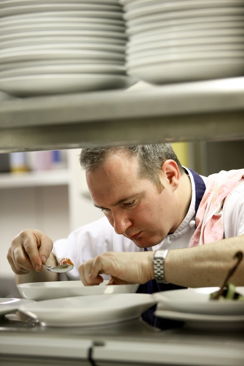 A young Niall McKenna plating up