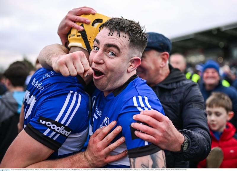 Sarsfields players Shane O'Regan and Aaron Myres celebrate after their side's victory in the AIB GAA Hurling All-Ireland Senior Club Championship semi-final match between Sarsfields of Cork and Slaughtneil of Derry