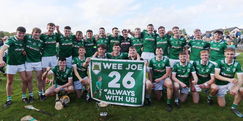 Carey celebrate their win over Glenariffe in the Antrim Intermediate Hurling final. The club had a special banner made in memory of their team mascot Joe Hegarty who tragically lost his life a few days after the first game in the championship campaign. Picture: Dylan McIlwaine