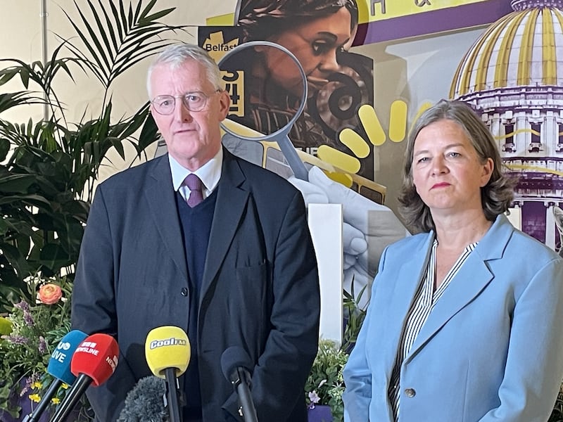 Northern Ireland Secretary Hilary Benn and parliamentary under-secretary of state Fleur Anderson speak to media at a community centre in Belfast