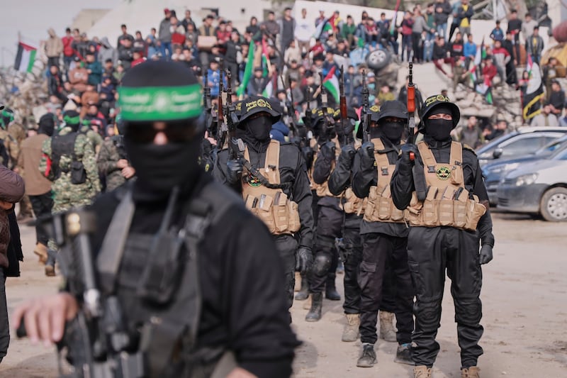 Hamas and Islamic Jihad fighters are deployed in central Gaza City ahead of the planned release of four Israeli female hostages (Abed Hajjar/AP)