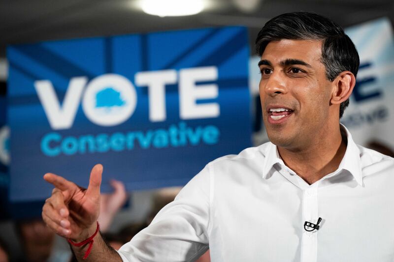 Prime Minister Rishi Sunak speaks during his visit to Amersham and Chiltern RFC