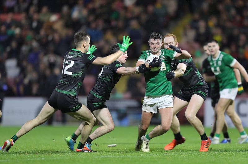 Newbridge's Mark McGrogan with Stevie O'Hara, Conleth McGuckian and Conor Glass of Glen in the Derry SFC final at Celtic Park