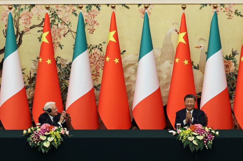 Chinese president Xi Jinping and Italian president Sergio Mattarella applaud before a signing ceremony at the Great Hall of the People in Beijing (Florence Lo/Pool Photo via AP)