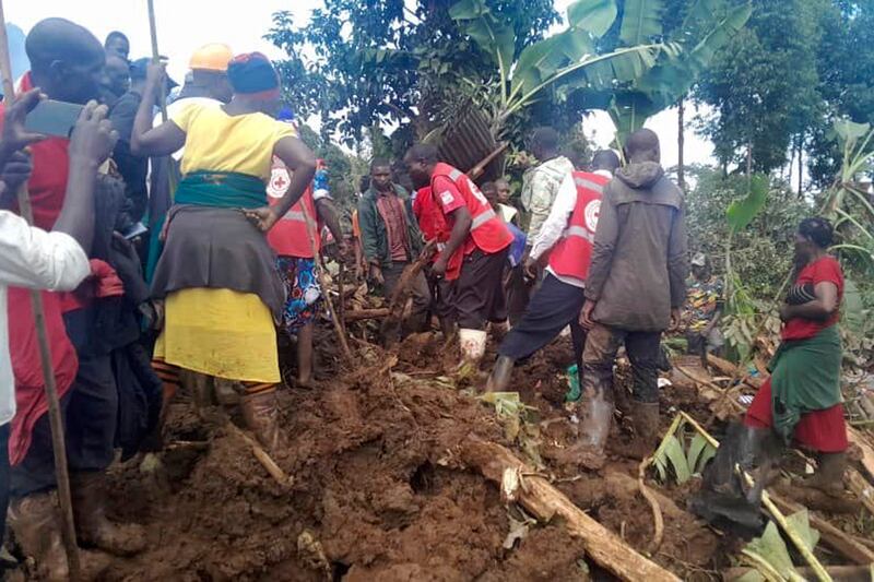 At least 40 homes were buried in the mountainous district of Bulambuli (AP)