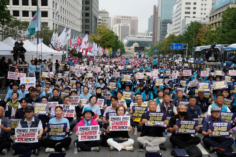 South Korean protesters stage a rally opposing the joint military exercises between the US and South Korea in Seoul (Ahn Young-Joon/AP)