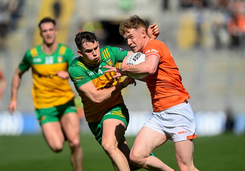 Donegal’s Caolan McColgan and Armagh’s Conor Turbit during todays Allianz GAA Football league Div 2 final at Croke Park, Dublin.  Picture: Mark Marlow