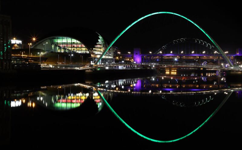 The Gateshead Millennium Bridge was also given a green makeover (Scott Heppell/PA)