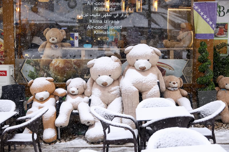 Teddy bears covered with snow outside a cafe in Sarajevo, Bosnia (Armin Durgut/AP)