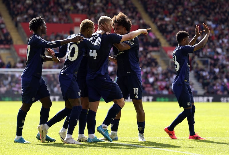 Matthijs de Ligt celebrates with his Manchester United team-mates after scoring the opening goal against Southampton