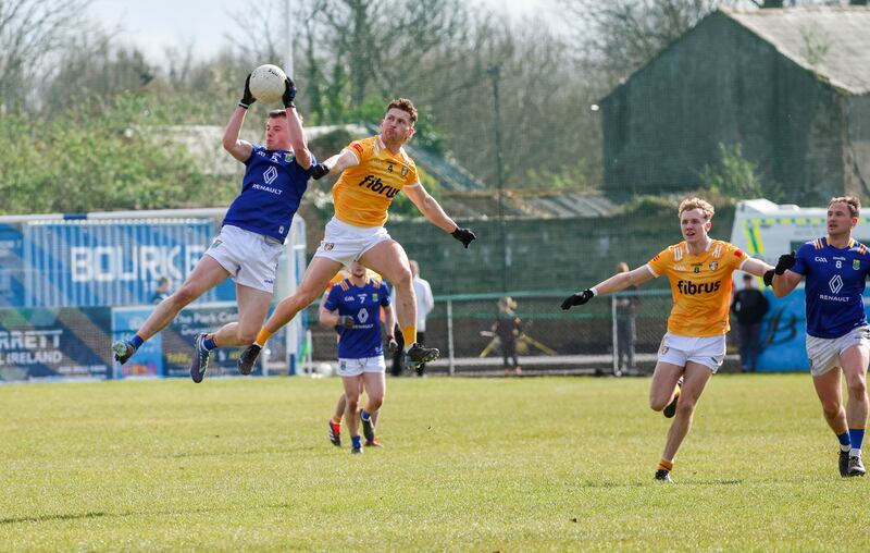 Antrim’s Kavan Keenan and Wicklow’s Matt Nolan in action during Sunday’s Allianz Football League Roinn 3 game at Corrigan Park in Belfast
PICTURE COLM LENAGHAN