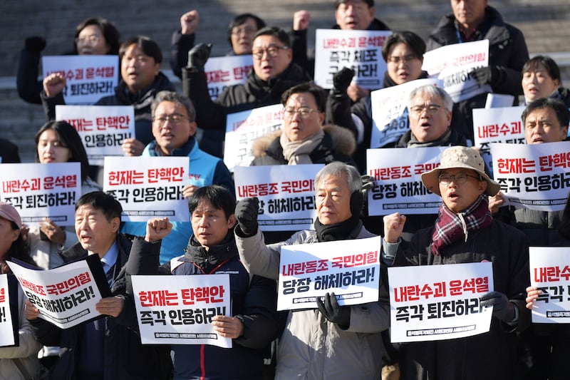 Members of civic groups shout slogans during a rally demanding South Korea’s impeached President Yoon Suk Yeol to resign (AP/Lee Jin-man)