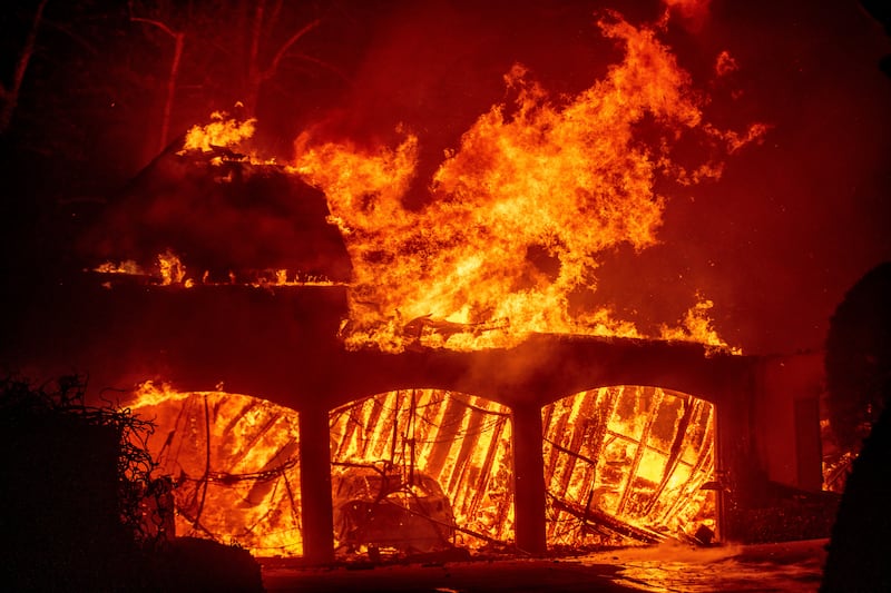 Homes have been burned by the Eaton fire in Altadena, California (AP)