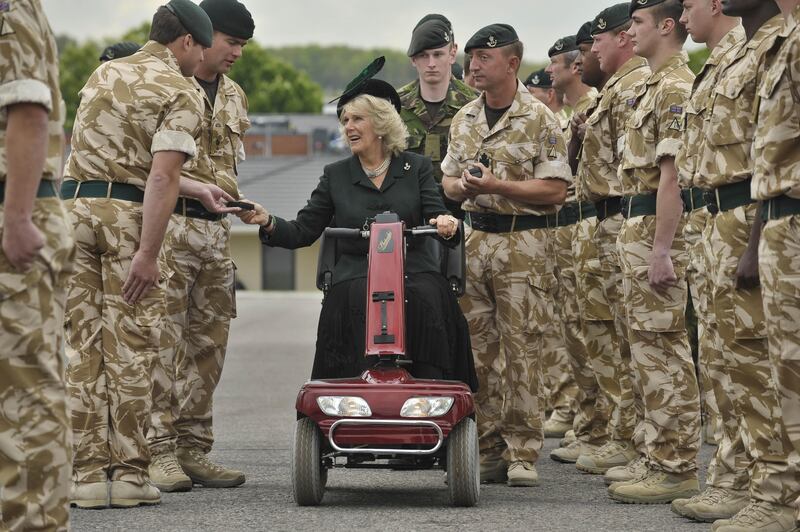 Camilla rode on a red mobility scooter as she presented medals to soldiers of 4th Battalion The Rifles at Bulford Camp, Wiltshire, in 2010