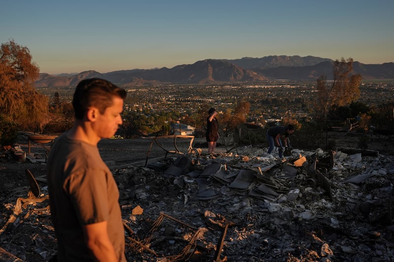 Louie Gonzalez visits what remains of his mother’s home after it was destroyed in the Mountain Fire in Camarillo (Jae C Hong/AP)