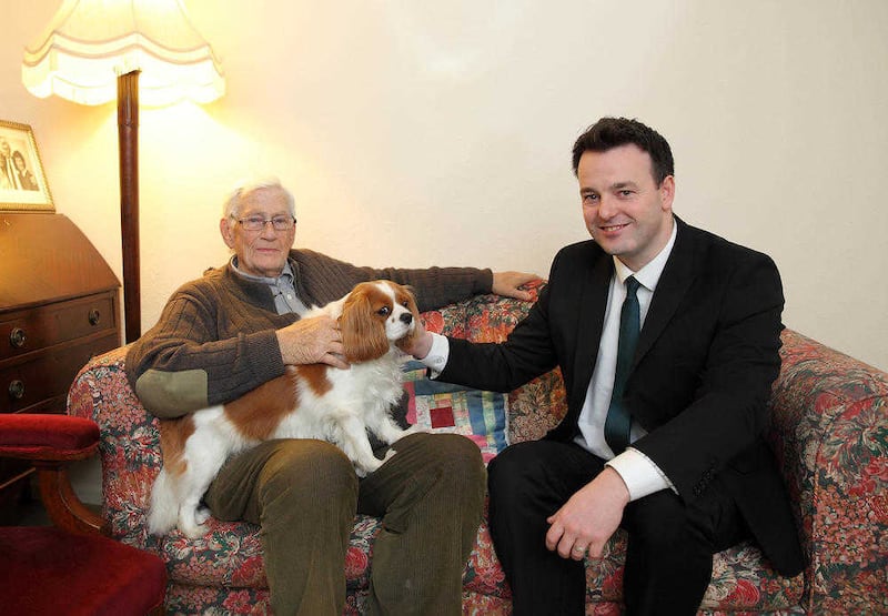 Seamus Mallon and spaniel Jessie alongside SDLP leadership candidate Colum Eastwood. Picture by Cliff Donaldson