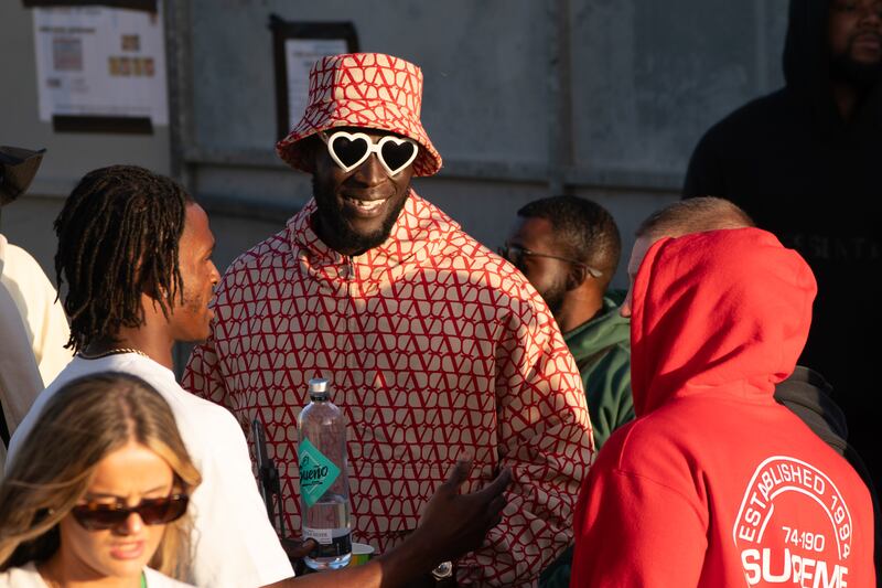 Stormzy watches D-Block Europe from the side of the stage at Glastonbury Festival at Worthy Farm in June