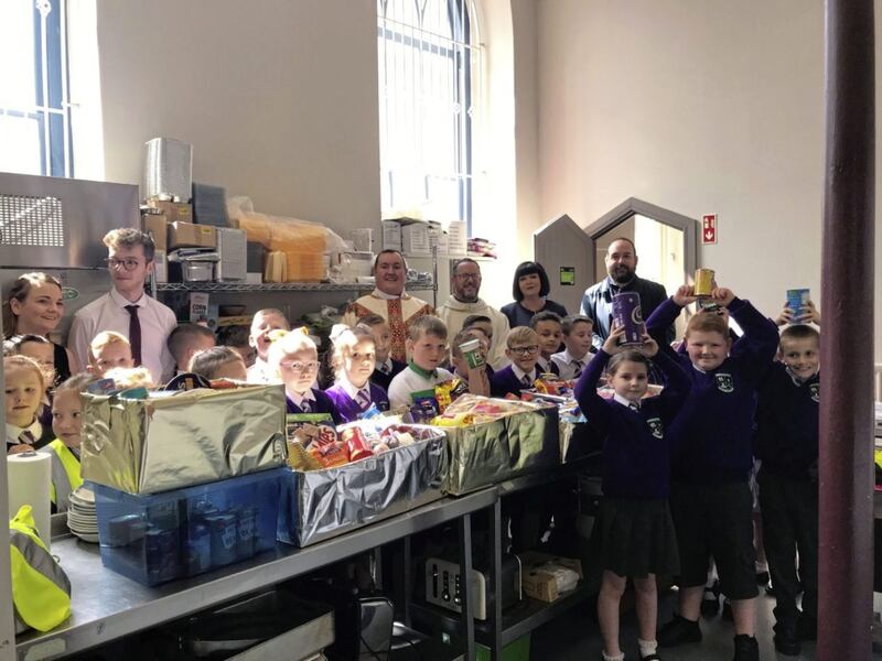 P4 children from Saint Patrick&#39;s Primary School have been working extremely hard to prepare hampers of food for the homeless who are helped by the Door of Mercy Soup Kitchen in Donegall Street. The children decided they wanted to end the school year by helping those who were in need in Belfast. The food hampers were presented to Fr Tony McAleese, Fr Eugene O&#39;Neill and Paul McCusker following the end-of-year school Mass which was celebrated last week. 