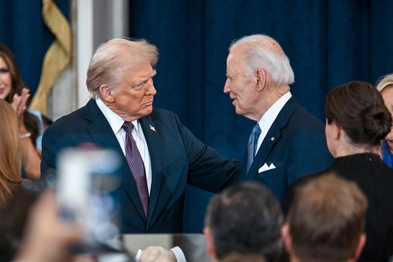 Donald Trump greets Joe Biden at the 60th Presidential Inauguration in the Rotunda of the US Capitol in Washington (Kenny Holston/The New York Times via AP, Pool)