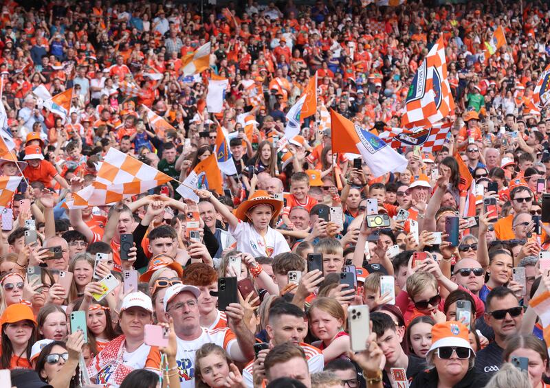 Armagh celebrate  with the fans at the Athletic grounds in Armagh on Monday, after winning the All Ireland.
PICTURE COLM LENAGHAN