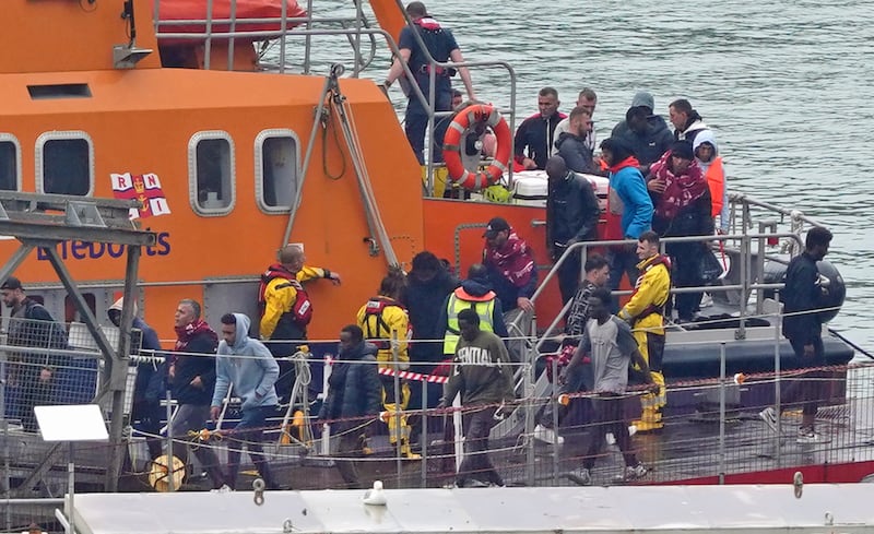 People thought to be migrants are brought into Dover