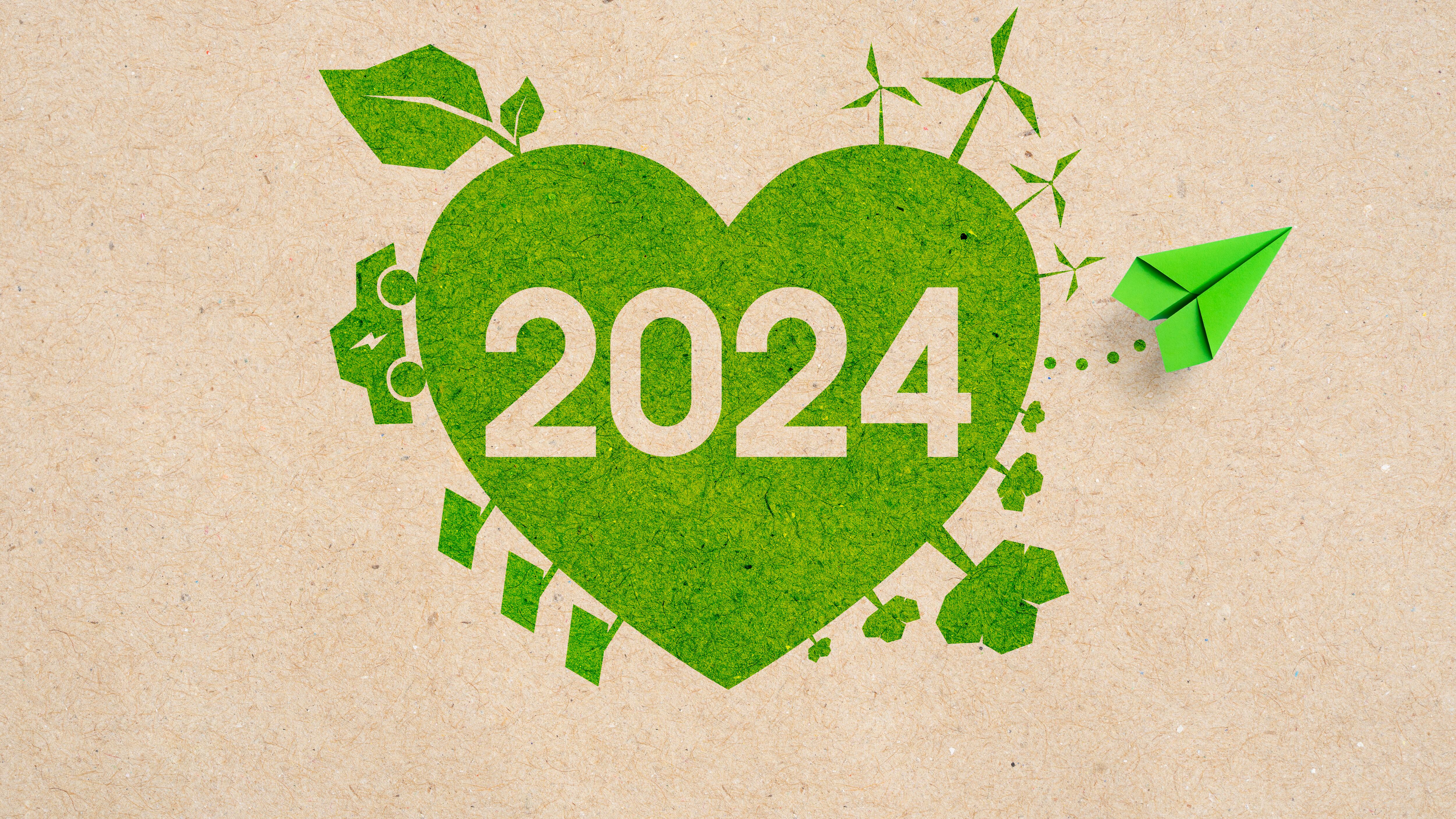 Green paper plane and green heart 2024, eco-friendly environmental concept