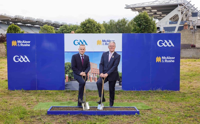 GAA President Jarlath Burns (right), cutting the first sold on the new €40m hotel project at Croke Park, with Martin Magee, managing director of McAleer and Rushe.