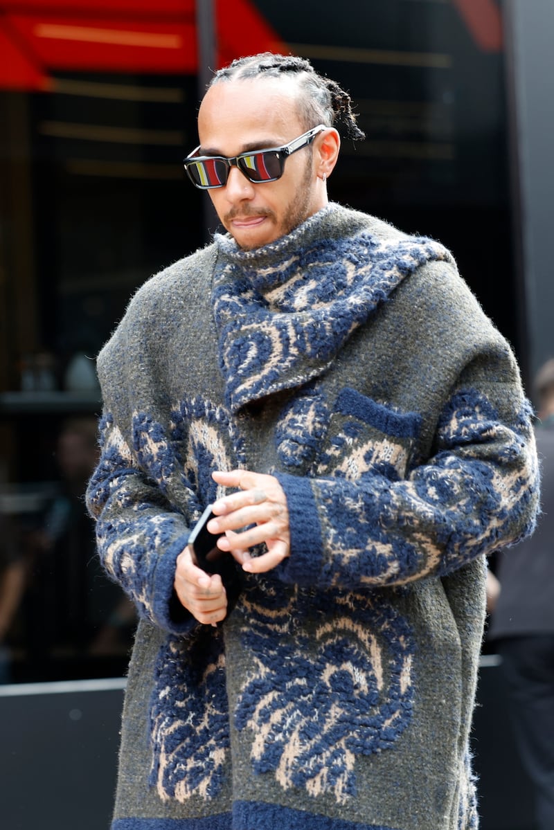 Lewis Hamilton arrives in the paddock ahead of the Belgian Grand Prix (Geert Vanden Wijngaert/AP)