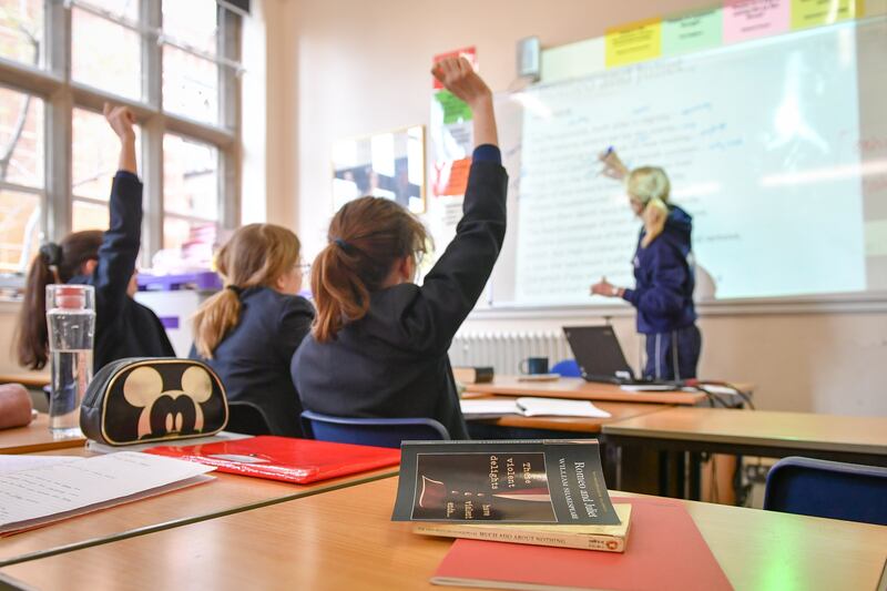 File photo dated 12/09/18 of a teacher and students in a classroom. Funding for the National Tutoring Programme is expected to end this academic year