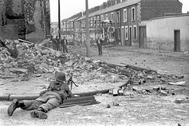 File photo dated 15/08/1969 of a soldier on lookout in the Falls Road area of Belfast as British troops were deployed onto the streets of Northern Ireland as part of Operation Banner in response to growing sectarian unrest. PRESS ASSOCIATION Photo. Issue date: Tuesday August 13, 2019. Op Banner lasted almost 38 years between 14 August 1969 and 31 July 2007 - more than 300,000 members of the UK Armed Forces were deployed in this time. Some 1,441 serving personnel died on deployment or in related paramilitary acts. See PA story ULSTER Banner. Photo credit should read: PA Wire. 