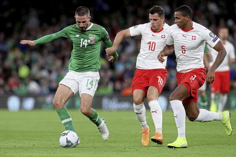 Republic of Ireland&#39;s Conor Hourihane (left) battles for the ball with Switzerland&#39;s Granit Xhaka (left) and Manuel Akanji (right) last month. Another tough test awaits in Geneva tonight 