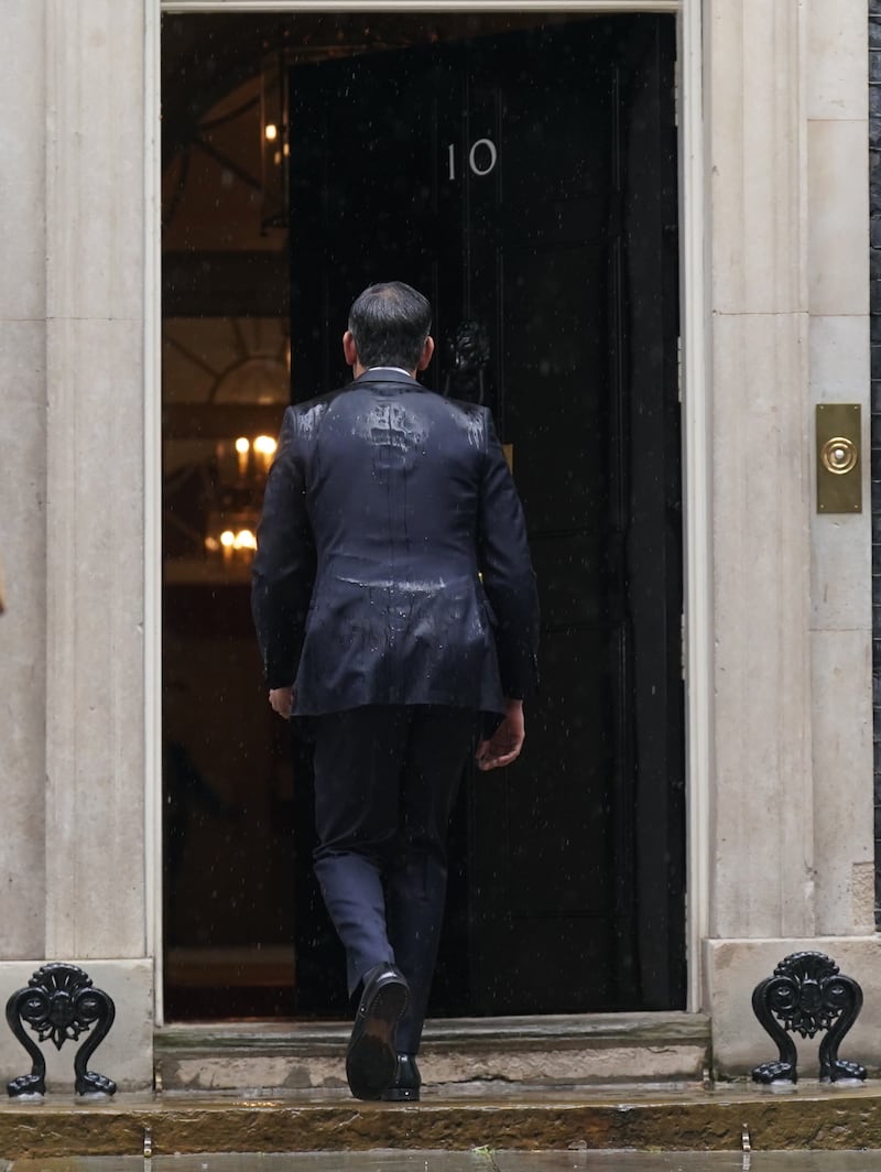 Rishi Sunak walks back in to 10 Downing Street after calling an election