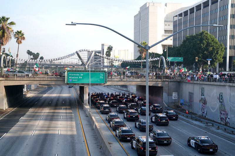 Law enforcement personnel on the 110 freeway during a protest calling for immigration reform (AP/Eric Thayer)