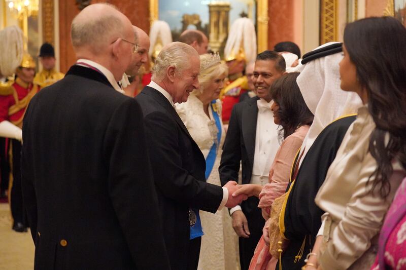 The King and Queen greeting guests in 2023