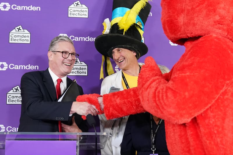 Labour leader Sir Keir Starmer shakes hands with Nick the Incredible Flying Brick and Bobby ‘Elmo’ Smith