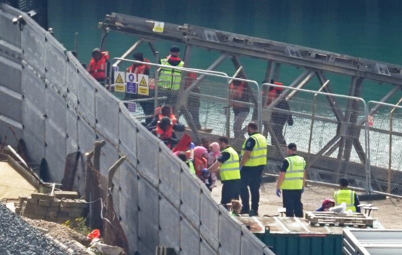 A group of people thought to be migrants are brought in to Dover, Kent, from a Border Force vessel following a small boat incident in the Channel. Picture date: Monday May 13, 2024.