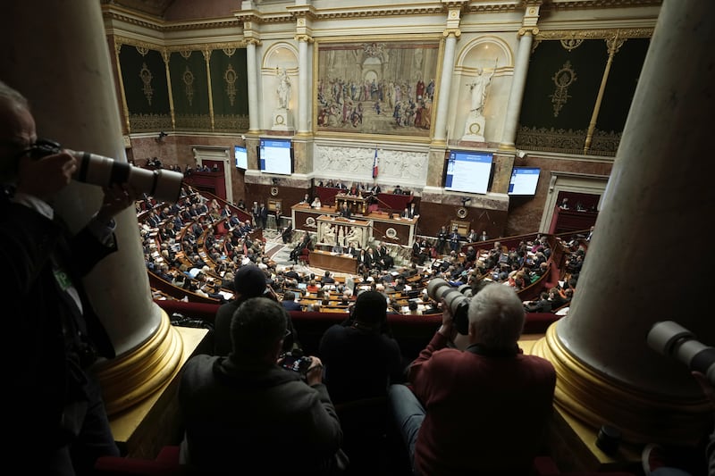 Press photographers focus on French prime minister Francois Bayrou delivering his general policy speech at the National Assembly in Paris (Thibault Camus/AP)