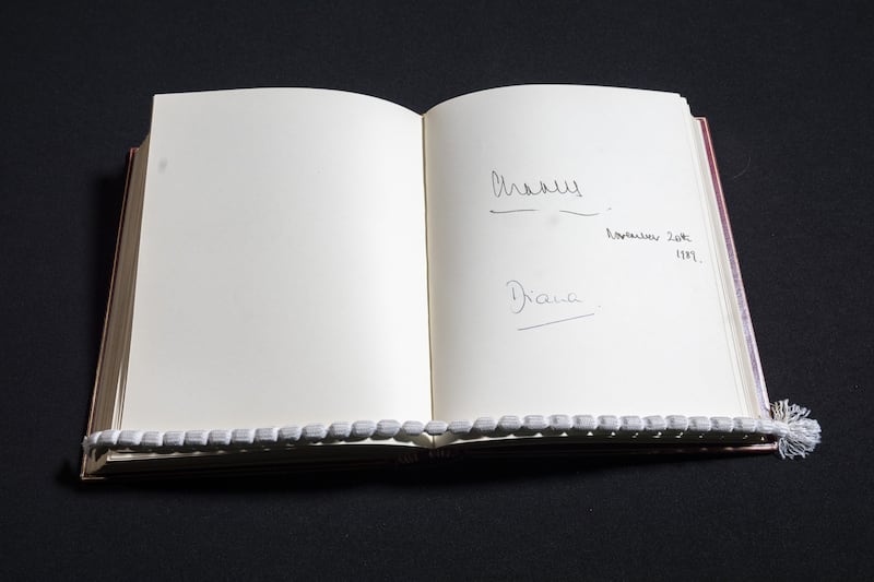 The signatures of then-Prince of Wales, now King, and his then wife Diana, Princess of Wales, when they visited 10 Downing Street on November 20 1989