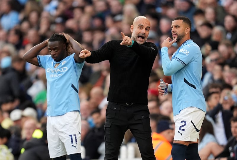 Manchester City manager Pep Guardiola (middle) says Kyle Walker (right) wants to leave the club