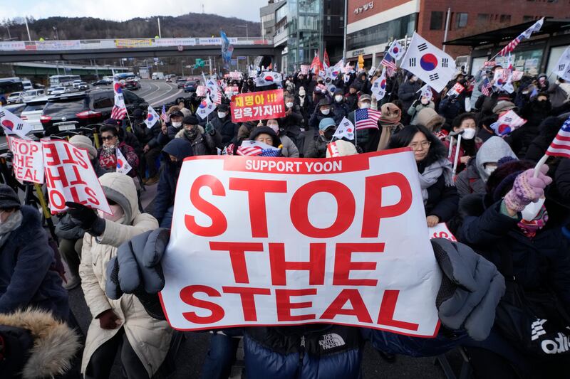 Supporters of impeached South Korean President Yoon Suk Yeol stage a rally to oppose his impeachment in Seoul (Ahn Young-joon/AP)